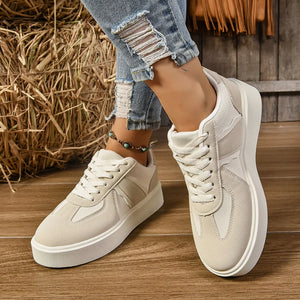 Beige panelled platform sneakers with contrast details and white laces.