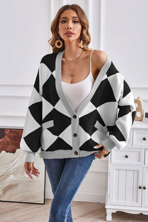 Diamond knit balloon sleeve cardigan in black and white with gray trim and pockets.