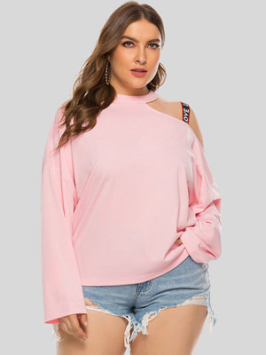 Blush pink sweatshirt with cut-out shoulder and "LOVE" strap detail.