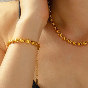 Gold orb chain bracelet with adjustable clasp detail