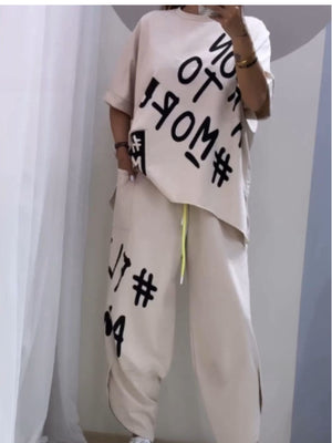 Khaki graphic tee and drawstring pants set with bold black lettering and hashtags.