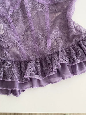 Purple lace bustier top with ruffled hem and butterfly appliques.