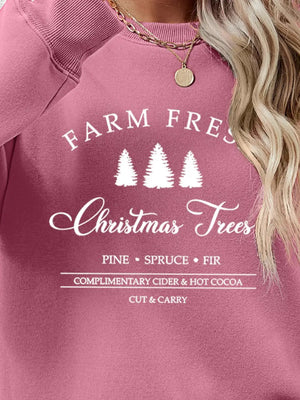 Blush pink graphic sweatshirt with Christmas trees and text detail.