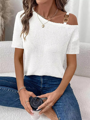 White waffle knit one-shoulder t-shirt with gold buckle detail on strap