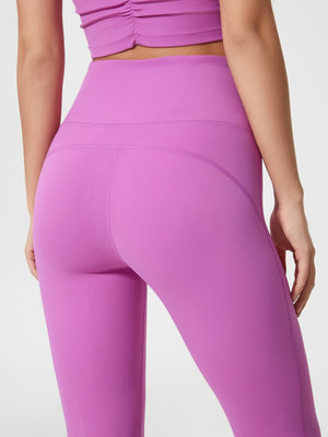 Flared sculpt leggings in Heliotrope Purple with high-rise waist and contouring seams.