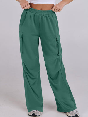 Green cargo sweatpants with wide legs and elastic waist.