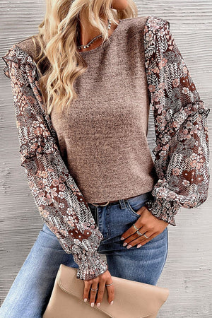 Knit top with floral chiffon sleeves and ruffled cuffs in dark gray.