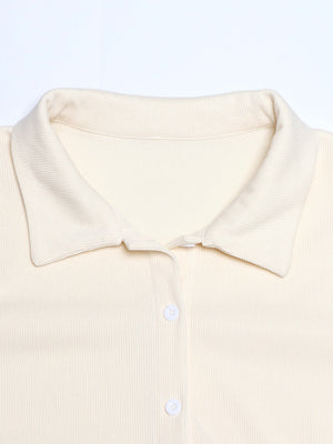 Cream ribbed knit lounge set top with collar and buttons.