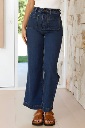 Sailor-inspired dark wash denim wide-leg trousers with patch pockets and a flared hem.