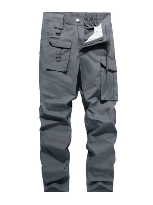 Men's grey functional cargo pants with multiple pockets and zip fly.