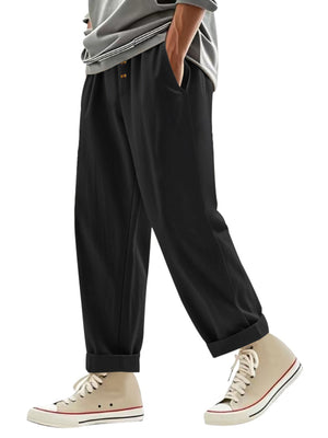 Men's black loose fit drawstring sweatpants with cuffed hems.