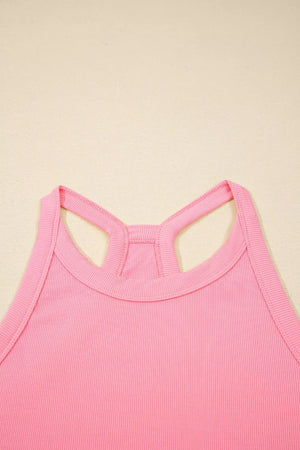 Dusty pink ribbed cropped tank top with racerback detail and contrast stitching.