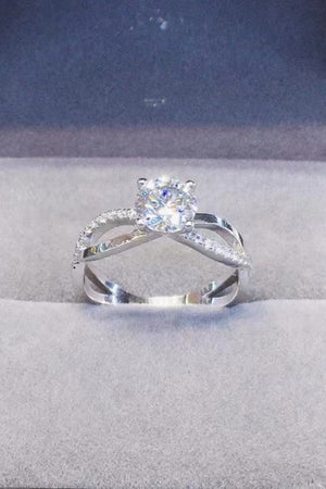 Silver crisscross ring with diamond halo and center stone