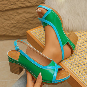 Green and blue open-toe block heel sandals with adjustable strap and contrast stitching.