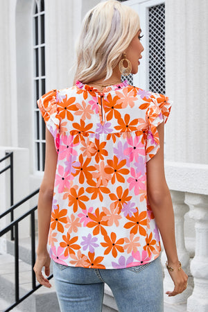 Multicolor floral print blouse with flutter sleeves and ruffled neckline.