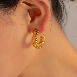 Gold vermeil spiral coil hoop earrings with a coiled design.
