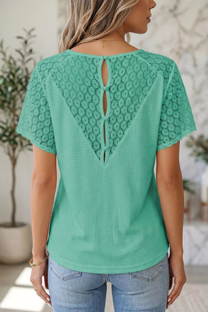 Mint green waffle knit shirt with lace back detail and button keyhole closure.