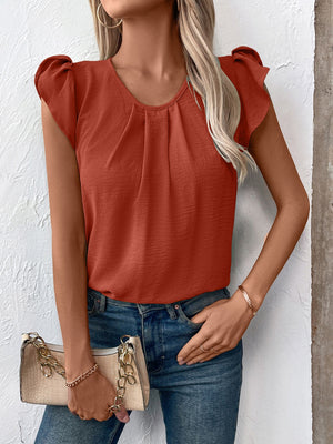 Terracotta pleated yoke flutter sleeve blouse with round neckline.