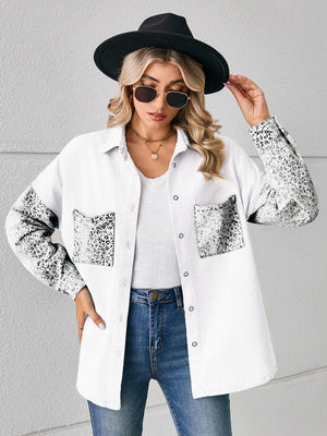 White denim overshirt with leopard print sleeves and pockets.