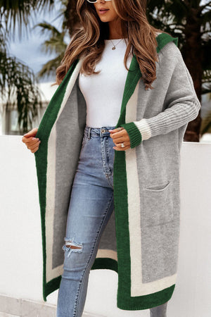 Color-blocked hooded knit maxi cardigan in gray with green and white trim, featuring pockets.