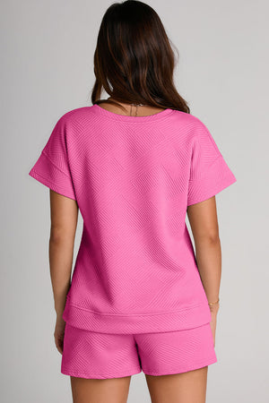 Fuchsia pink quilted tee and shorts set with geometric pattern.