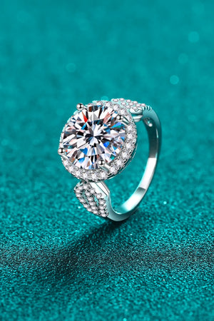 Silver halo moissanite ring with sculpted band and pavé accents