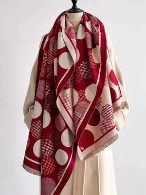 Deep red and cream polka dot textured scarf with fringe detail.