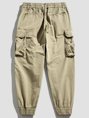 Khaki cargo joggers with flap pockets and elastic cuffs.