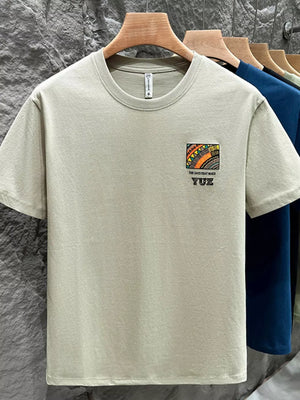Men's Matcha Green cotton crew t-shirt with abstract graphic detail and text.