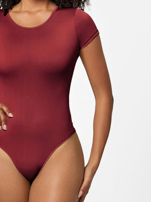 Burgundy short sleeve scoop-neck bodysuit with a smooth finish.