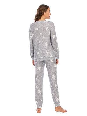 Heather Gray knit loungewear set with all-over white star print. Long sleeve top and cuffed pants.