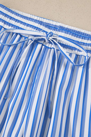 Maternity pants with blue and white vertical stripes, elastic waistband, and drawstring tie.