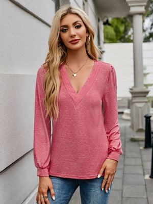 Plunge neckline gathered sleeve top in strawberry pink, with a textured neckline detail.