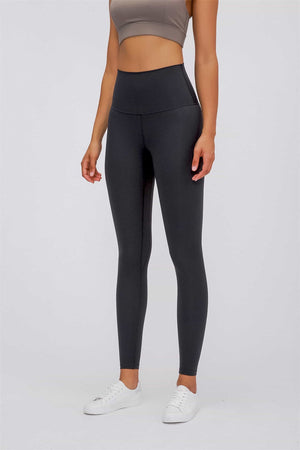 Black high rise leggings with a seamless waistband and full length legs.