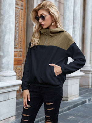 Quilted shoulder block fleece hoodie in dark blue and khaki with quarter zip and front pocket.