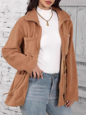 Caramel teddy fleece utility jacket with zip front, chest pockets, and drawstring waist.