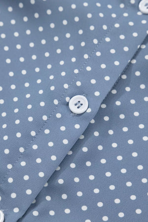 Polyester polka dot shirt with white buttons and cuffed short sleeves.