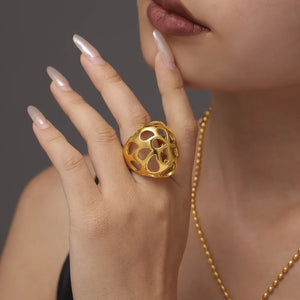 Gold openwork orb ring with a contemporary, casual style.