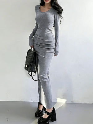 Light gray ruched long-sleeve bodycon maxi dress with a scoop neck.