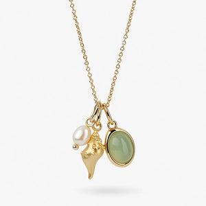 Gold necklace with seashell, pearl, and green gemstone charms