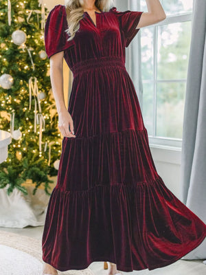 Wine red velvet maxi dress with tiered skirt and smocked waist.
