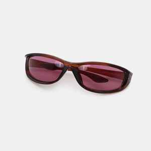 Sculpted sport sunglasses in brown with dark purple lenses and silver stud accents.