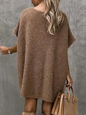Mocha knit cocoon dress with short sleeves and a relaxed fit, styled with a handbag.