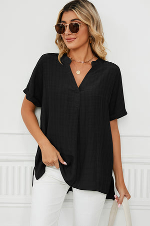 Black gathered back yoke blouse with rolled sleeves and V-neck