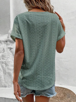 Sage eyelet v-neck tunic top with short sleeves and a relaxed fit.