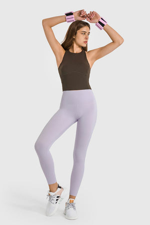 Lilac high-waist performance leggings with a seamless design and ankle length.
