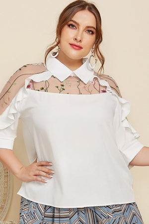 White blouse with sheer embroidered yoke and ruffle sleeves.