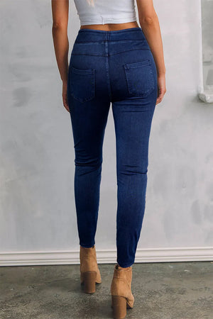 Dark wash denim jeggings with faux pockets and a sculpted fit.