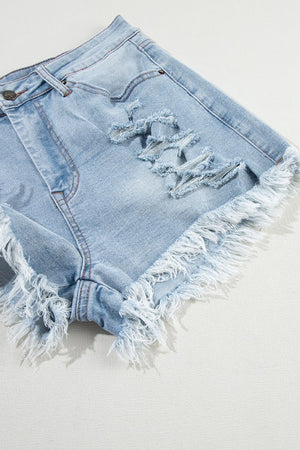 Light blue denim cutoff shorts with distressed rips and frayed hem