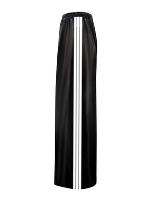 Black faux leather wide leg track pants with white side stripes and elastic waistband.